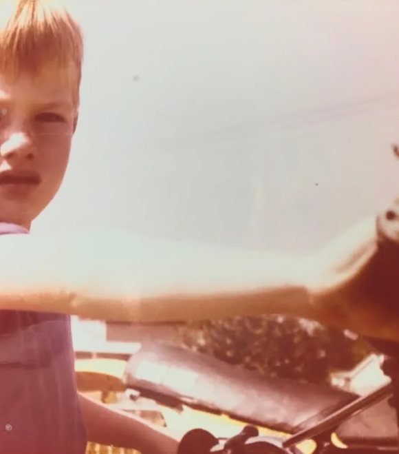 Mark Farmer as a young boy on his first motorbike