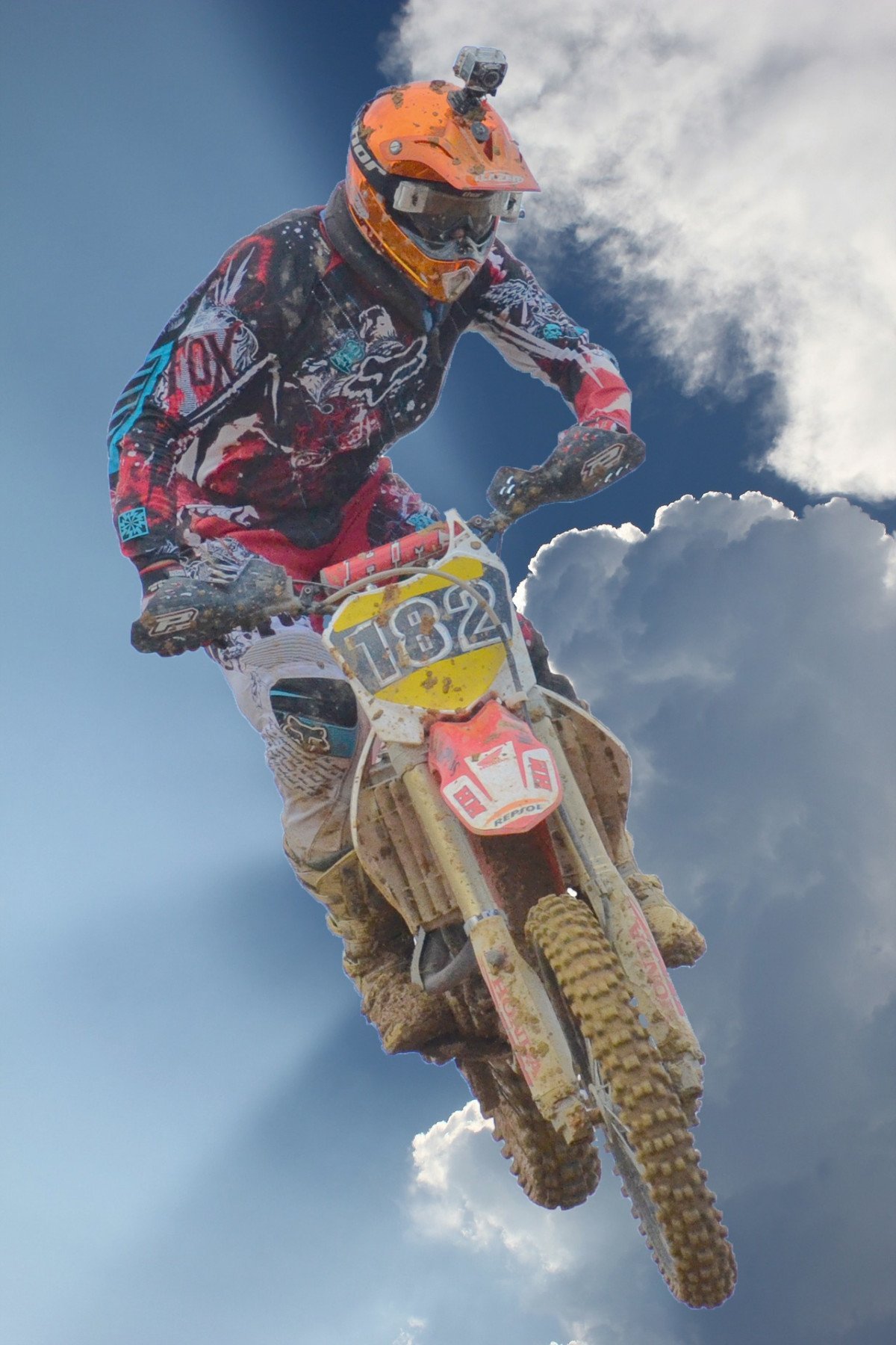 Motocross bike airborne over a jump